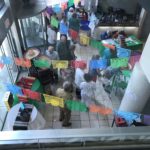 People walking into main lobby with fiesta decorations