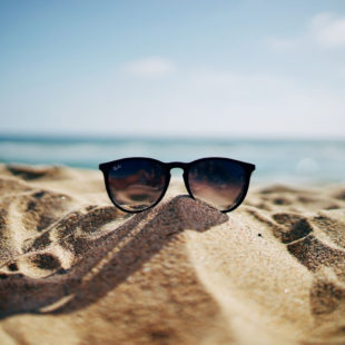 sunglasses on sand